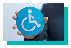 Hand holding a disability icon
