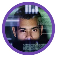 Man looking at code on a screen