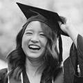 Monsterâs 2024 State of the Graduate Report - woman smiling and touching graduation cap